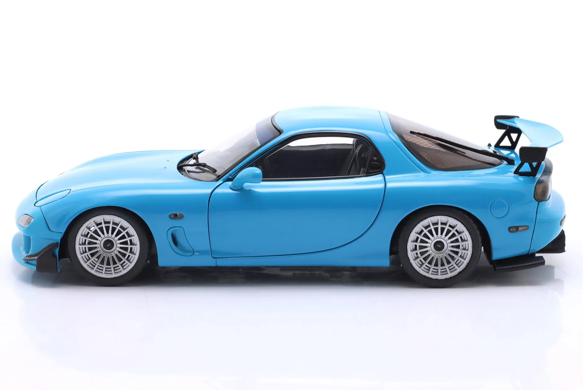Mazda RX-7 Typ RS (FD3S) Baujahr 1999 neonblau 1:18 Solido