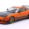Mazda RX-7 Typ RS (FD3S) Baujahr 1999 orange / schwarz 1:18 Solido