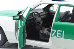 Mercedes-Benz 230E (W124) Polizei Baujahr 1989-1993 weiß / grün 1:18 Norev