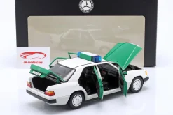 Mercedes-Benz 230E (W124) Polizei Baujahr 1989-1993 weiß / grün 1:18 Norev