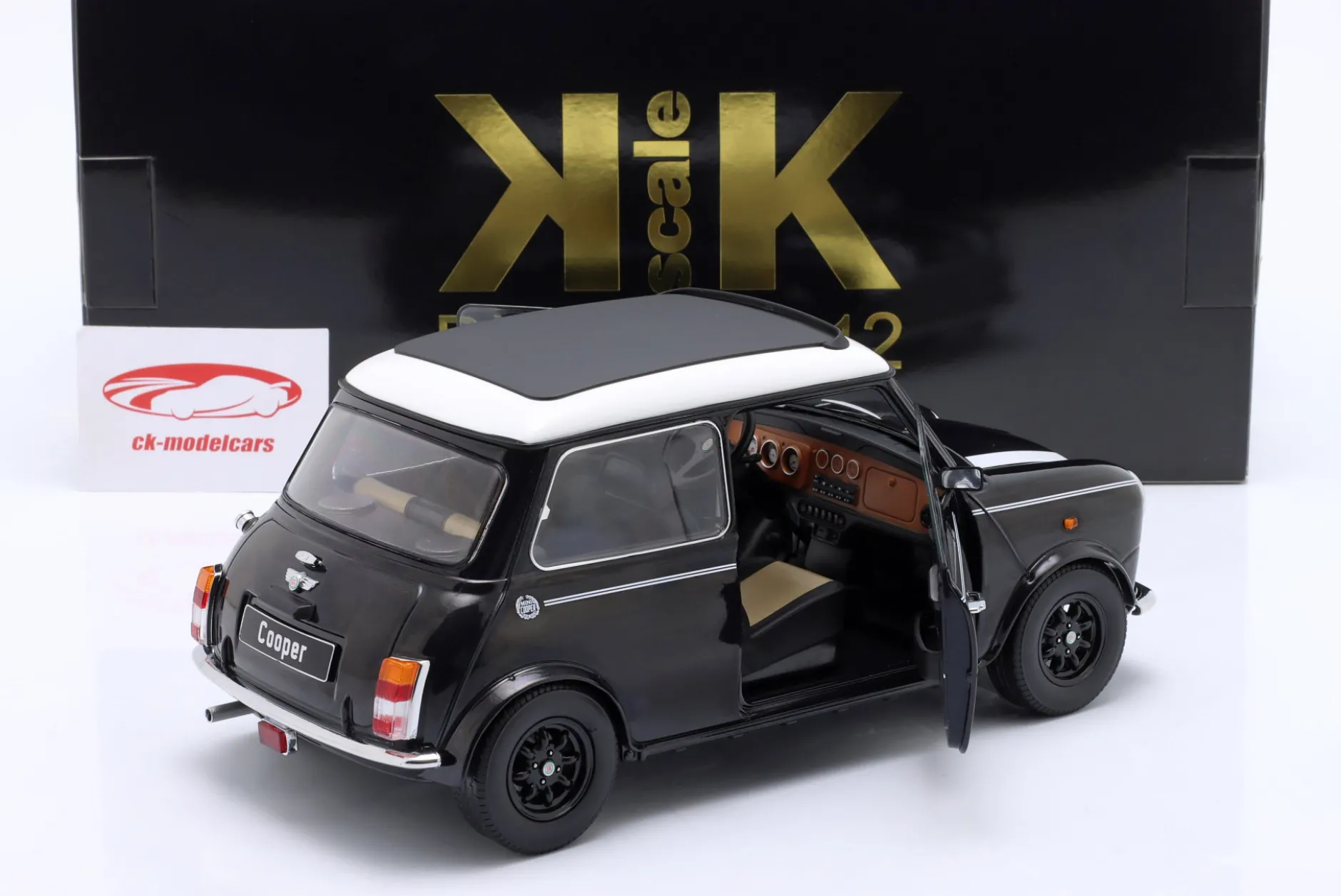 Mini Cooper mit Schiebedach schwarz metallic / weiß LHD 1:12 KK-Scale