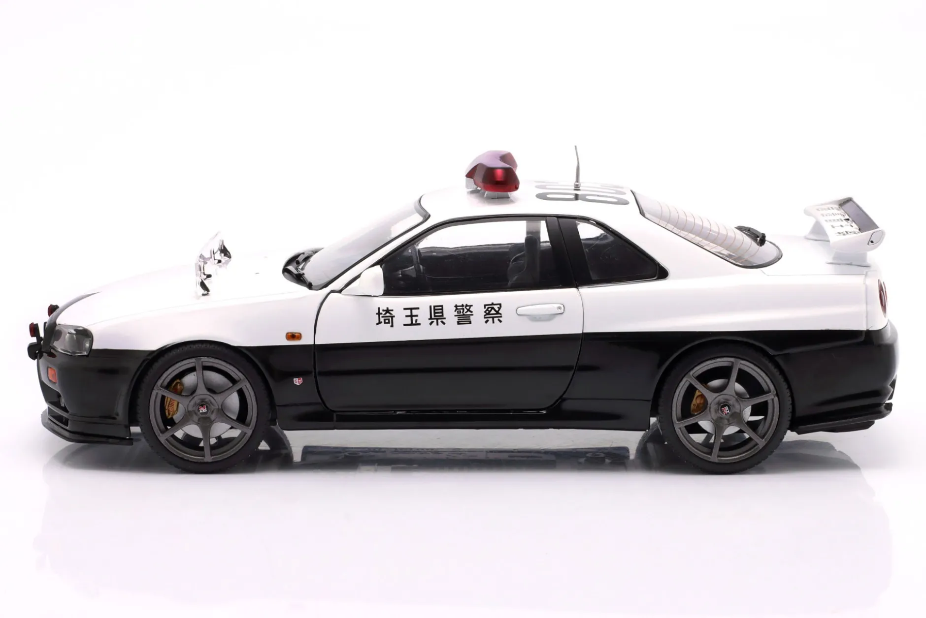 Nissan Skyline GT-R Polizei Japan Baujahr 1999 weiß 1:18 Solido
