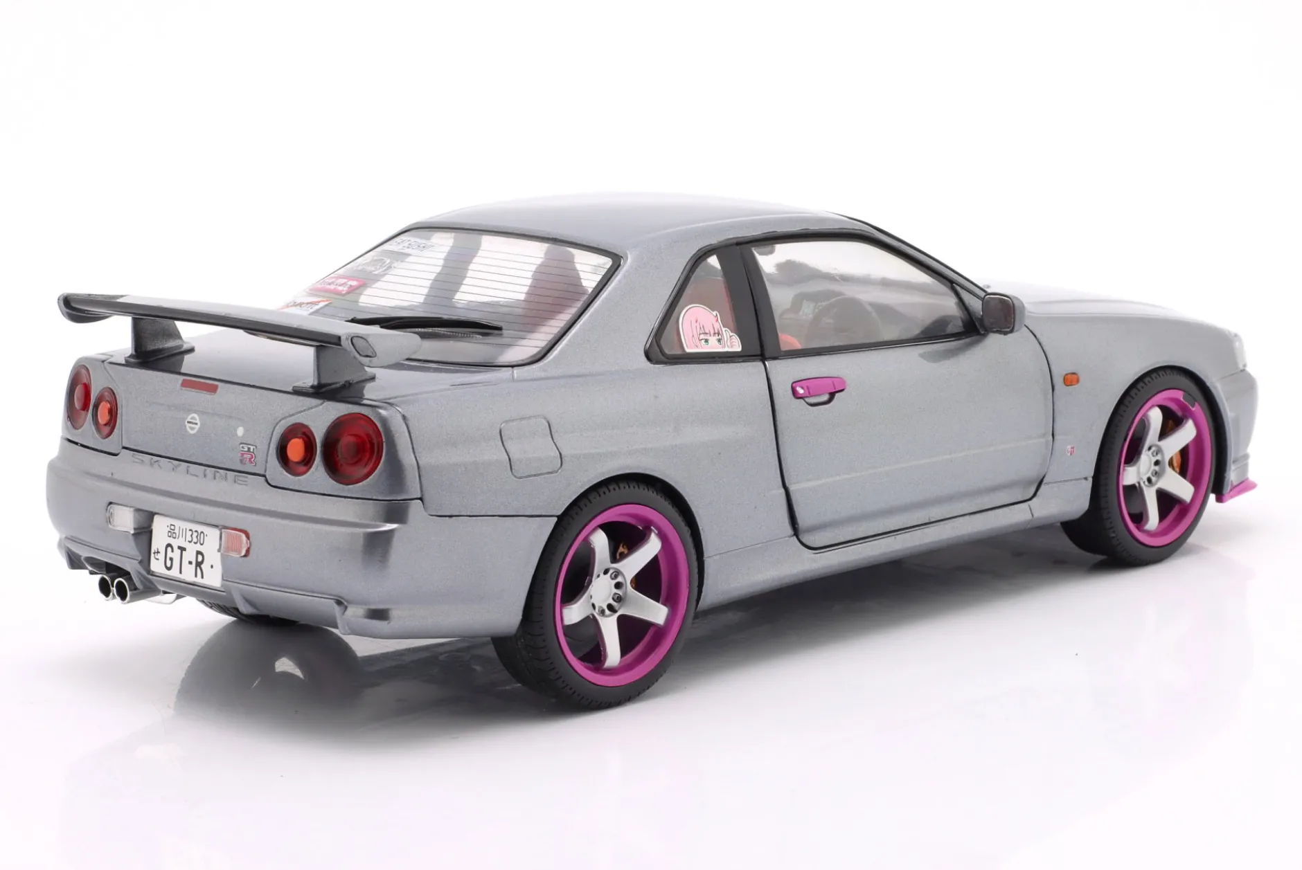 Nissan Skyline GT-R (R34) Baujahr 1999 silbergrau metallic / lila 1:18 Solido