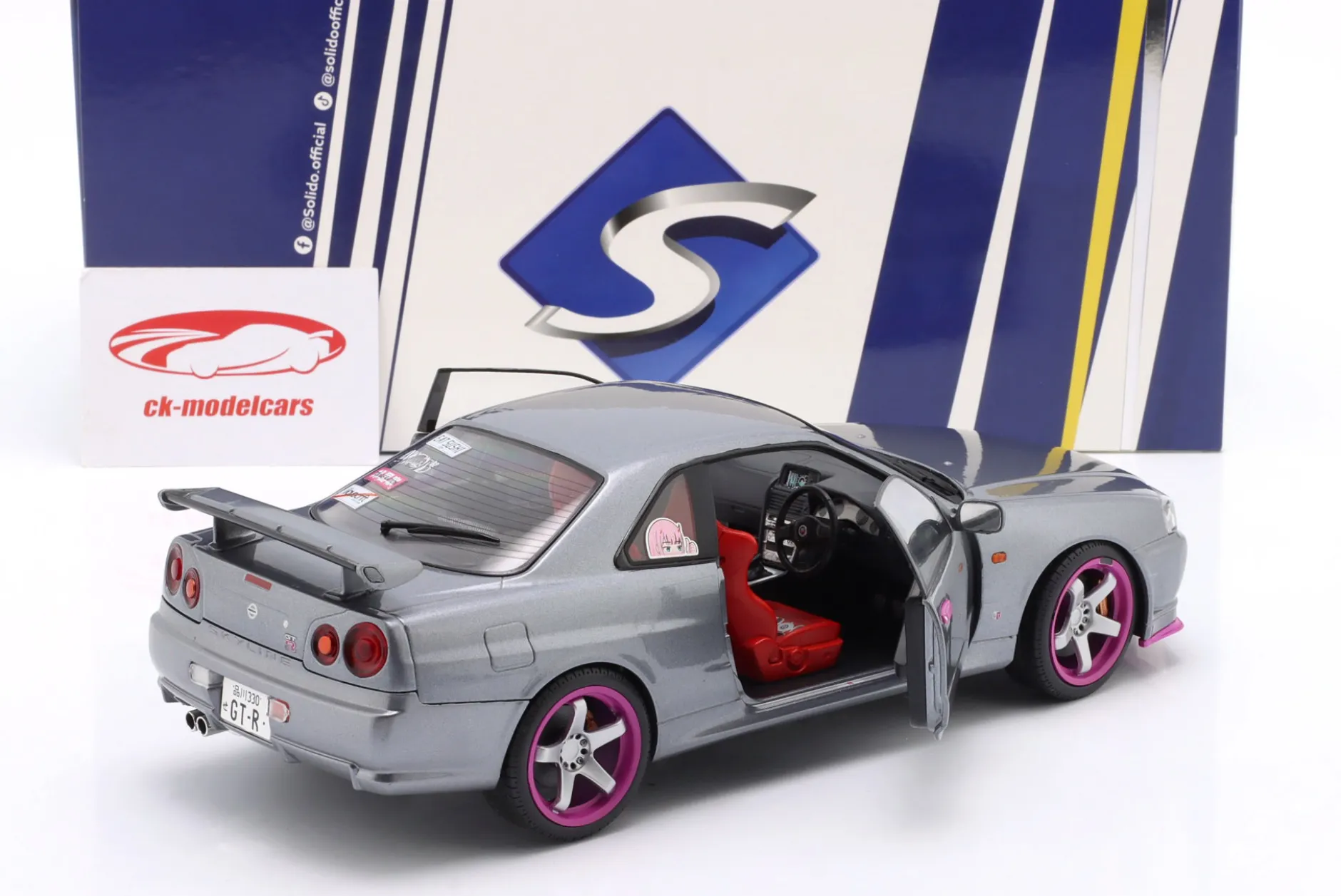 Nissan Skyline GT-R (R34) Baujahr 1999 silbergrau metallic / lila 1:18 Solido