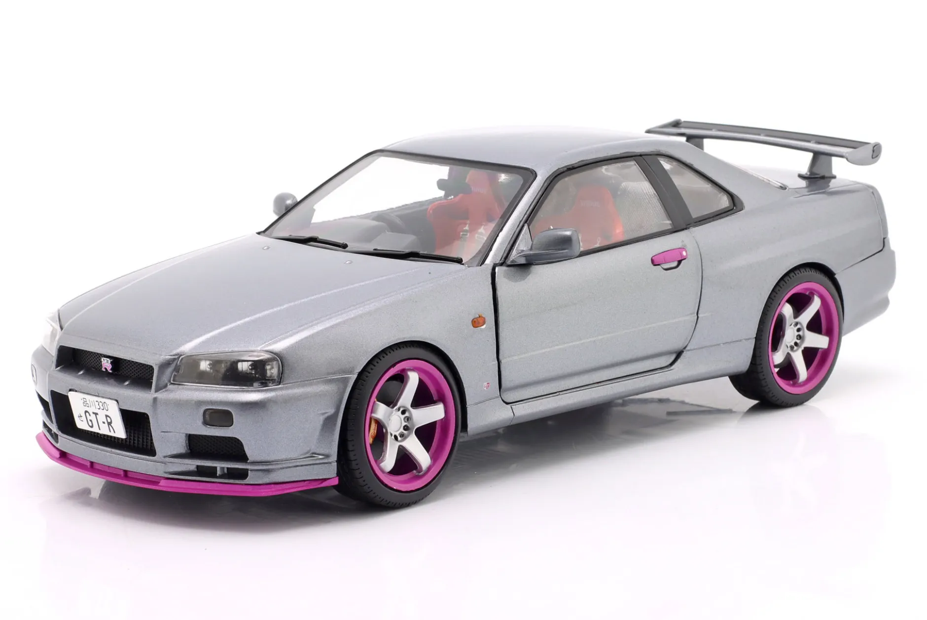 Nissan Skyline GT-R (R34) Baujahr 1999 silbergrau metallic / lila 1:18 Solido