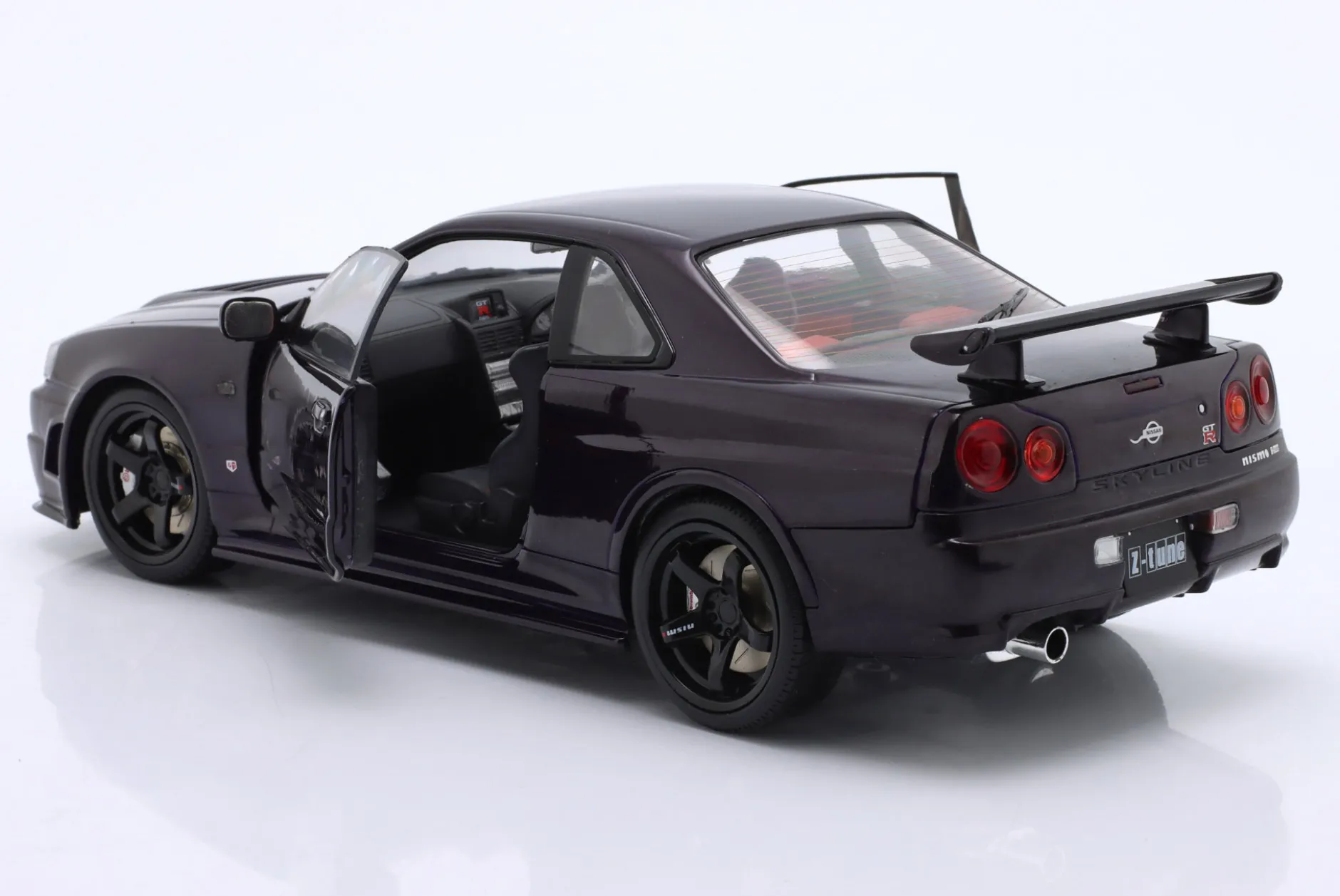 Nissan Skyline (R34) GT-R Z Tune Baujahr 1999 lila 1:18 Solido