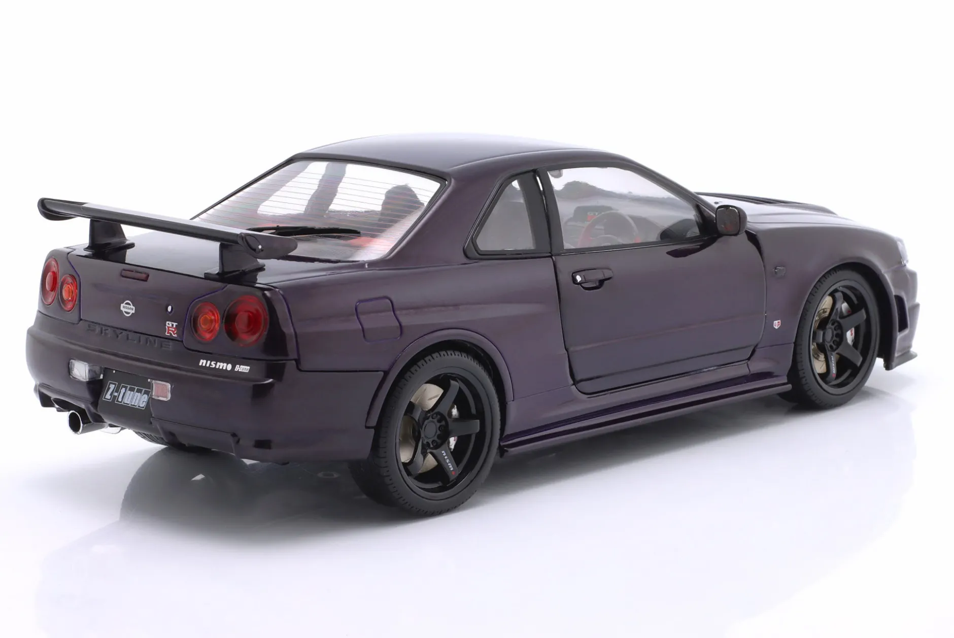 Nissan Skyline (R34) GT-R Z Tune Baujahr 1999 lila 1:18 Solido