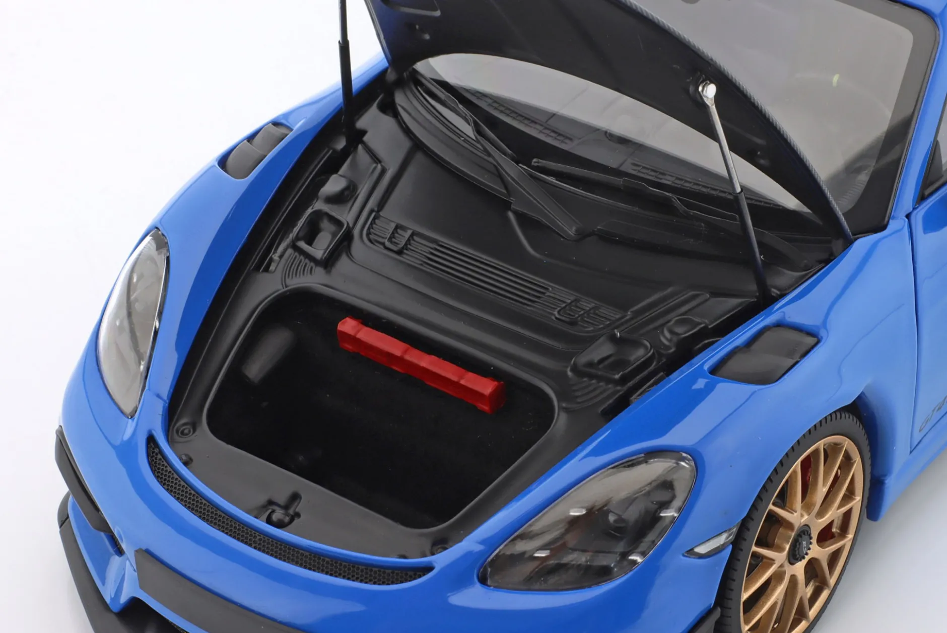 Porsche Cayman GT4 RS mit Weissach-Paket Baujahr 2024 blau 1:18 Minichamps