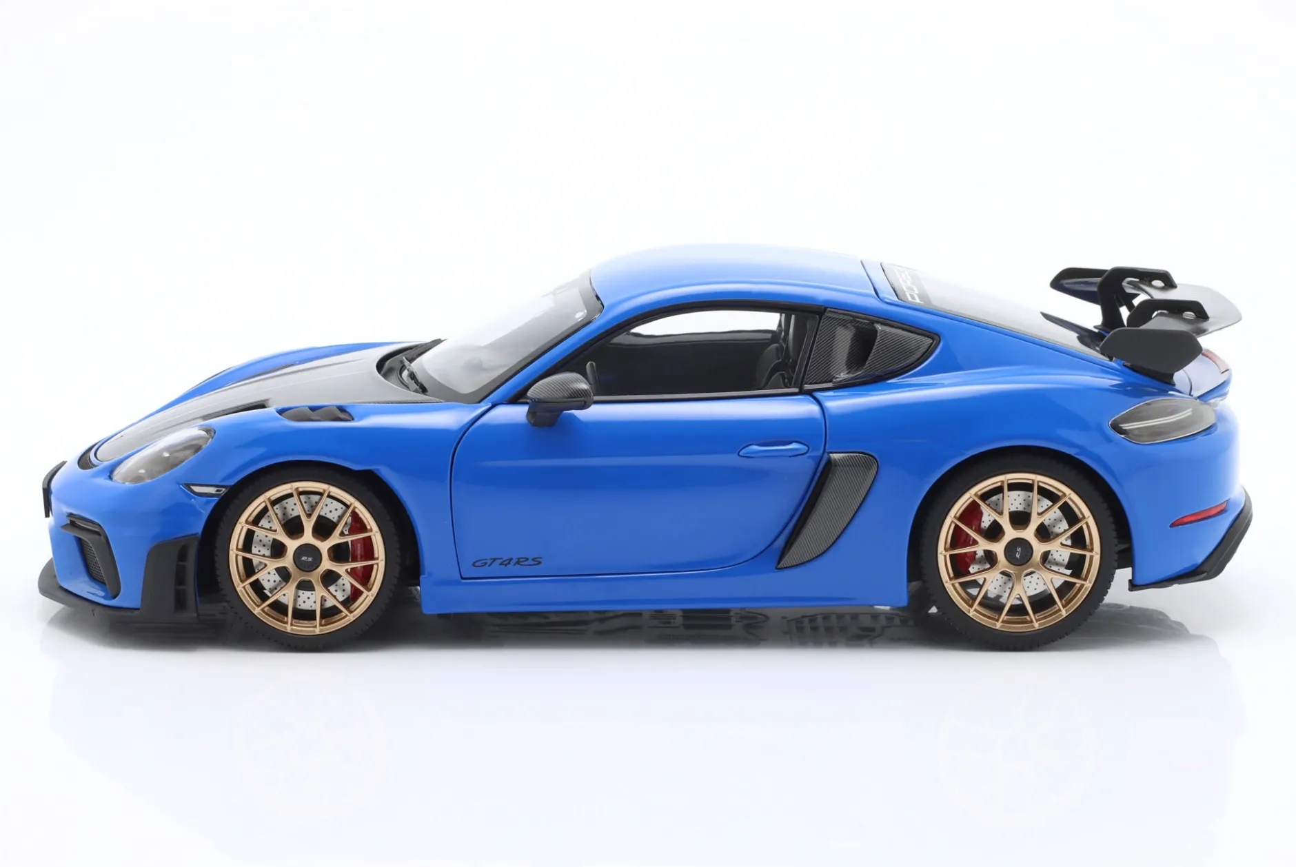 Porsche Cayman GT4 RS mit Weissach-Paket Baujahr 2024 blau 1:18 Minichamps