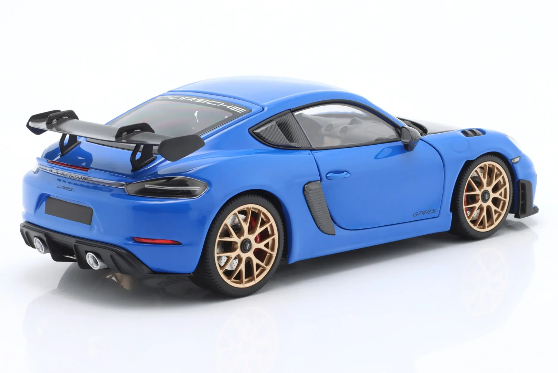 Porsche Cayman GT4 RS mit Weissach-Paket Baujahr 2024 blau 1:18 Minichamps