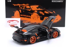 Porsche 911 (992) GT3 RS Baujahr 2022 schwarz / orange Felgen 1:18 Minichamps